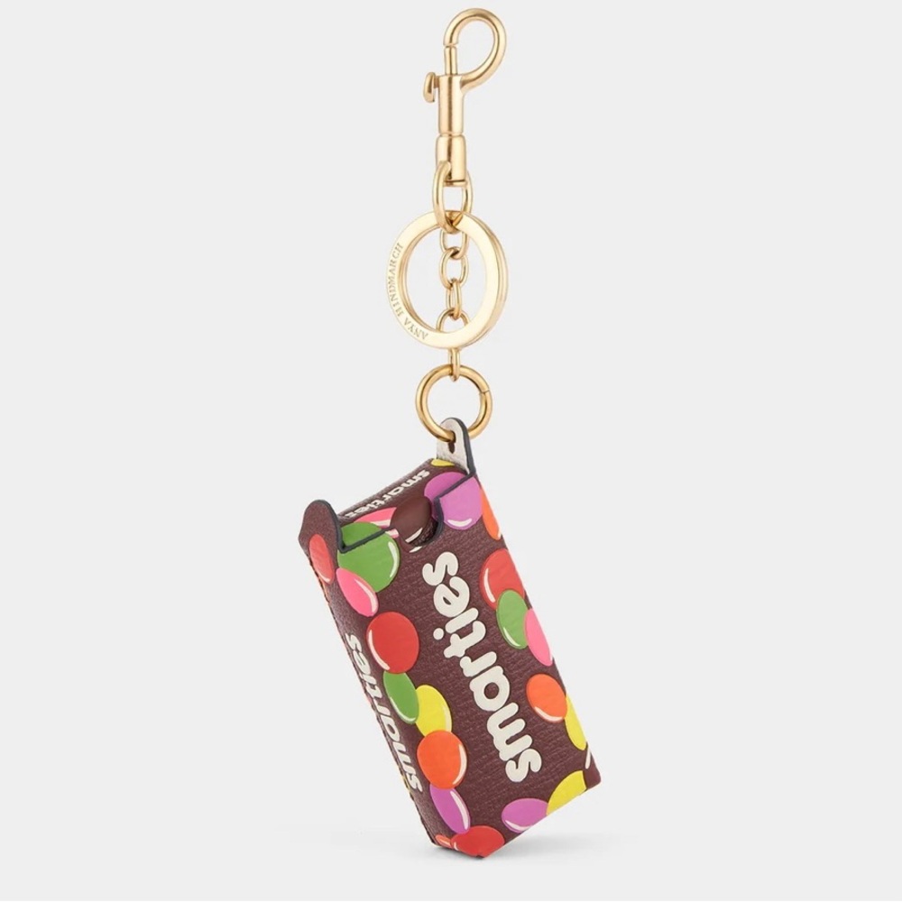 Anya Hindmarch Smarties Charm Grainy Capra in Mahogany